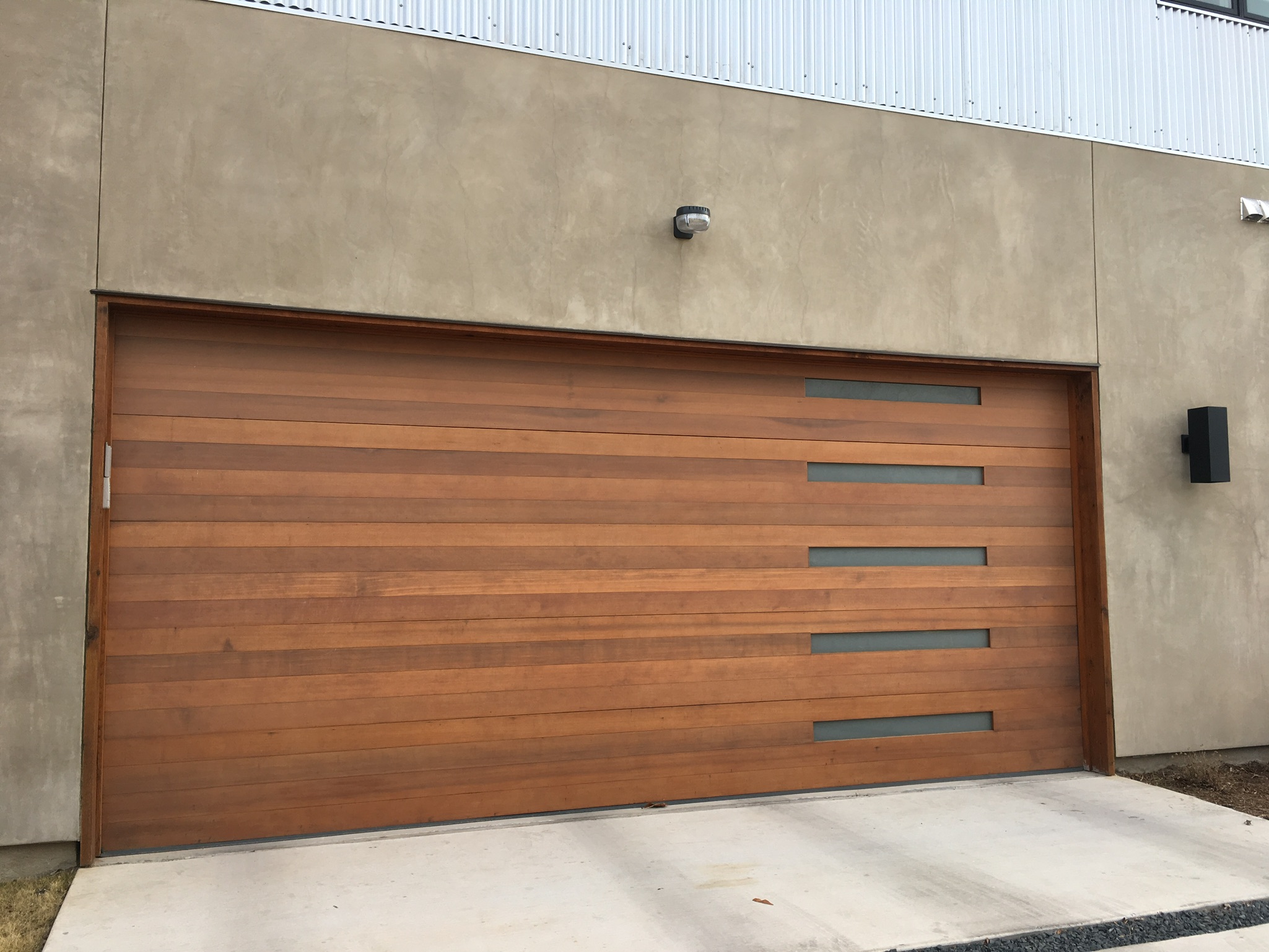 modern wood plank garage door with narrow windows