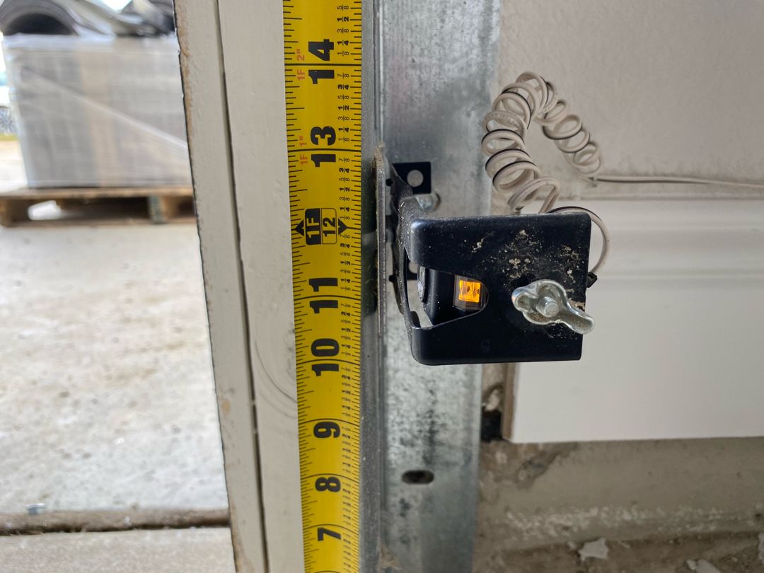 Repairing blocked sensor to fix garage door bouncing