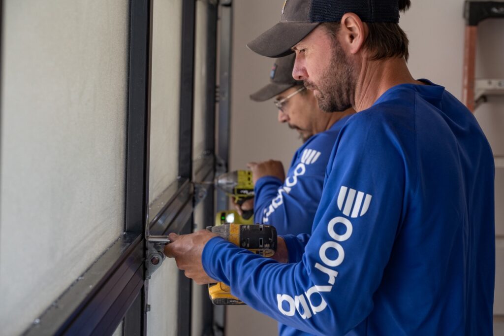 securing new hinges to a garage door