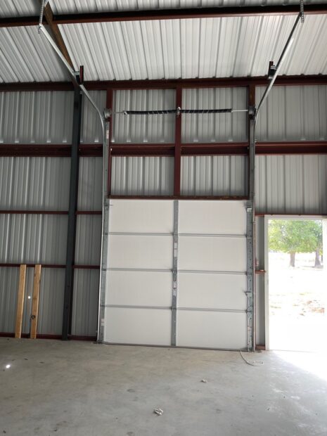 54" high lift overhead garage door for a shop installed by doorvana garage doors in rhome texas