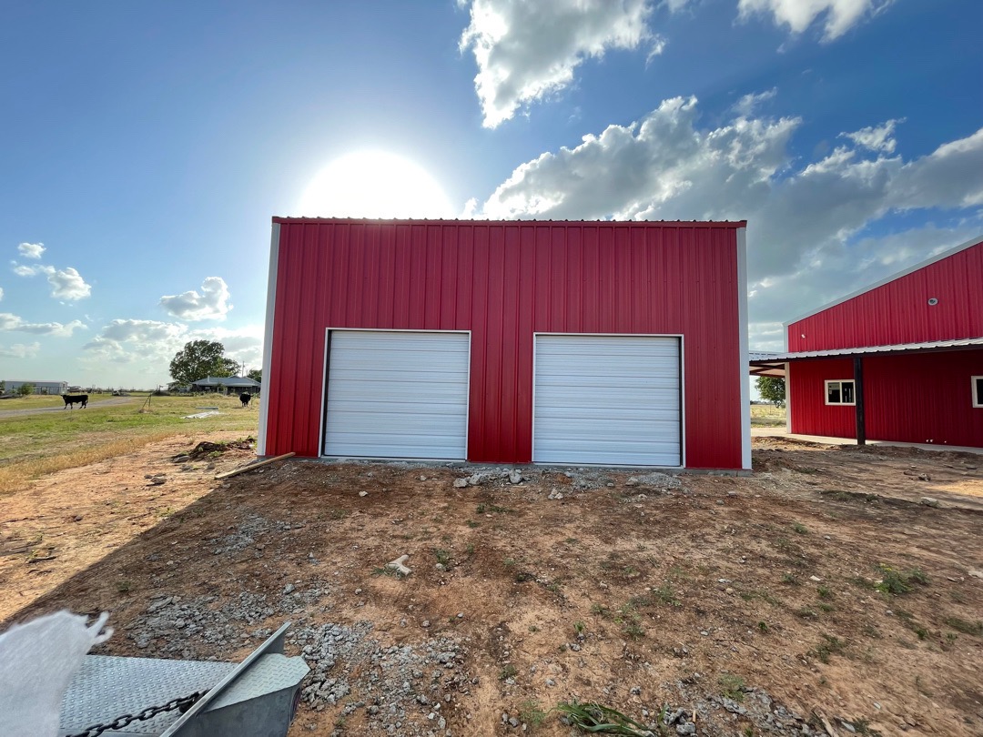 two amarr 2412 9x8 sectional overhead light duty commercial garage doors installed by doorvana in rhome texas