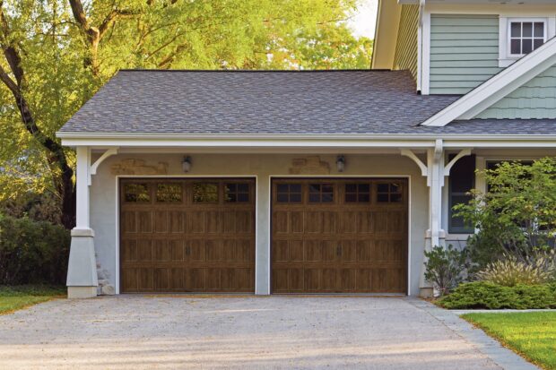 wood look steel carriage house garage door available from doorvana