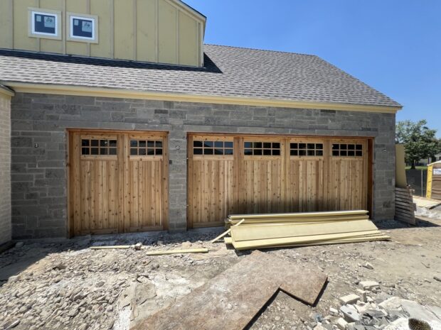 cedar carriage house garage door with glass installed in farmers branch texas