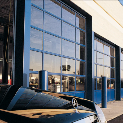 A row of commercial glass garage doors, Clopay Architectural Series-Aluminum, with blue frames