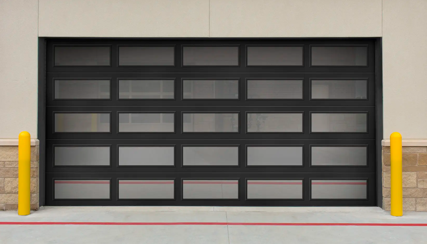 A modern black Clopay Architectural Series-Steel garage door with multiple rectangular glass panels