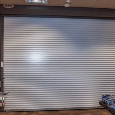 White commercial rolling fire door in a retail setting