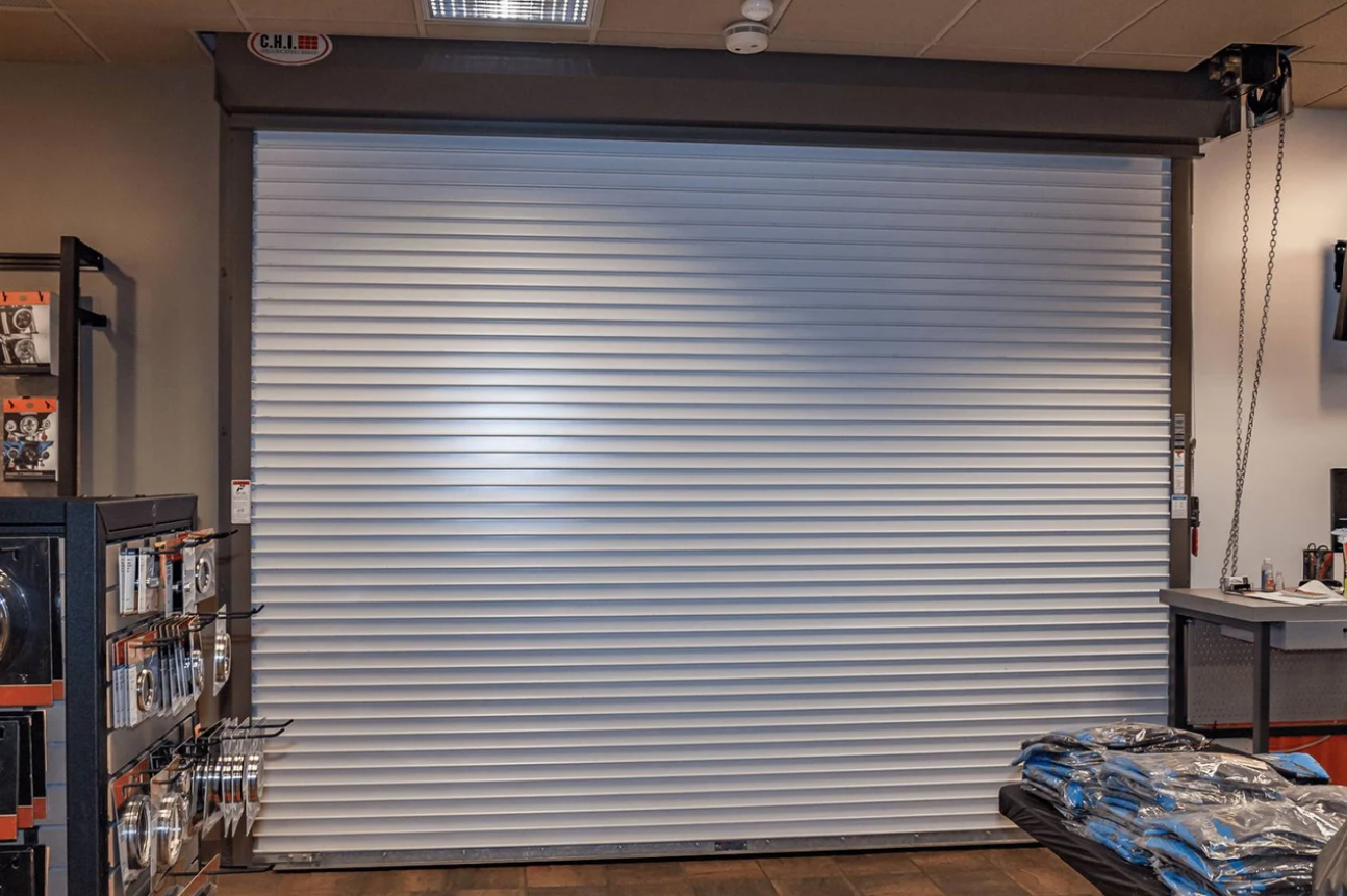 White commercial rolling fire door in a retail setting