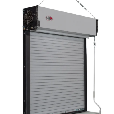 A gray, metal fire-rated rolling shutter door