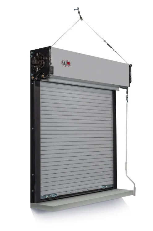 A gray, metal fire-rated rolling shutter door