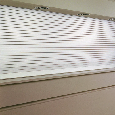 A closed silver Clopay Counter and Shutter Door covering a counter or service window