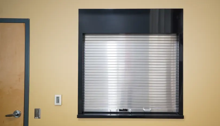 A silver Clopay Counter and Shutter Door covering a service counter