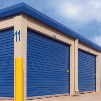 A row of blue self-storage Clopay Rolling Sheet Doors units with roll-up doors