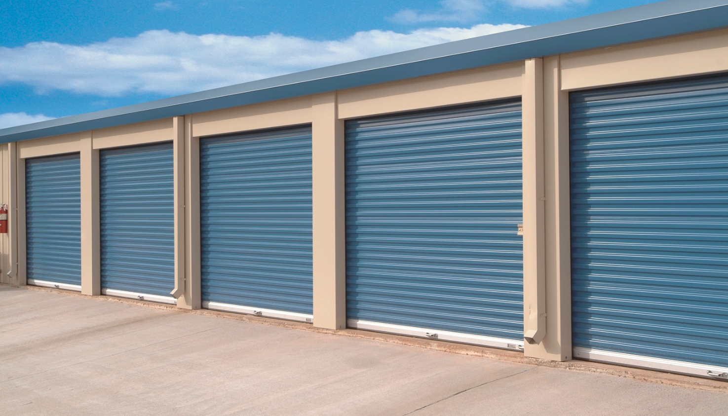 A row of blue self-storage units with Clopay Rolling Sheet Doors