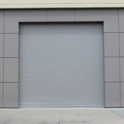 A large gray roll-up door on a commercial building.