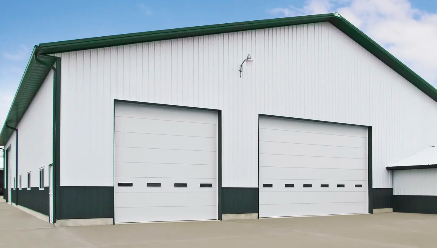 White industrial overhead Clopay Industrial Series doors on a building