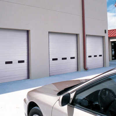 Ribbed steel Clopay Industrial Series garage doors with windows