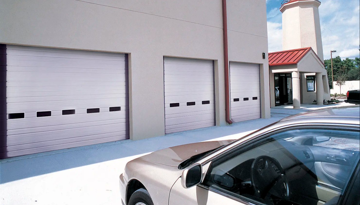 Ribbed steel Clopay Industrial Series garage doors with windows