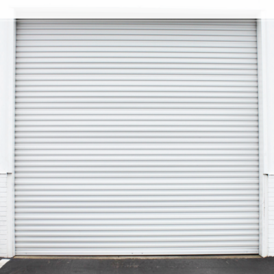 A closed white commercial Janus Series 3100 Commercial Sheet Door.