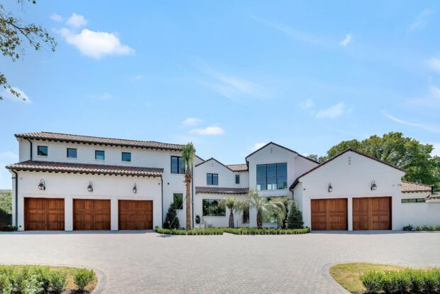 cedar garage doors on a white stucco house