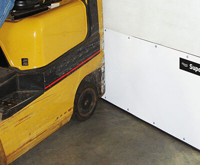 A yellow forklift next to an Amarr Superflex white industrial impact door