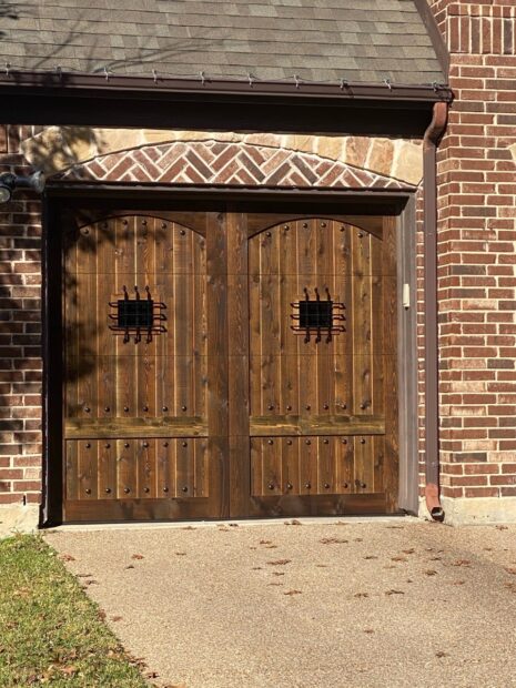 eyebrow top cedar garage door with speakeasy