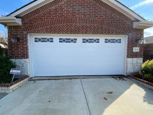 16x7 steel garage door with beadboard and decorative windows