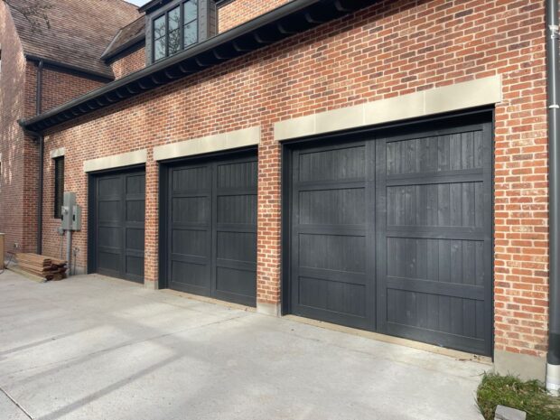 3-9x8 black stained cedar garage doors