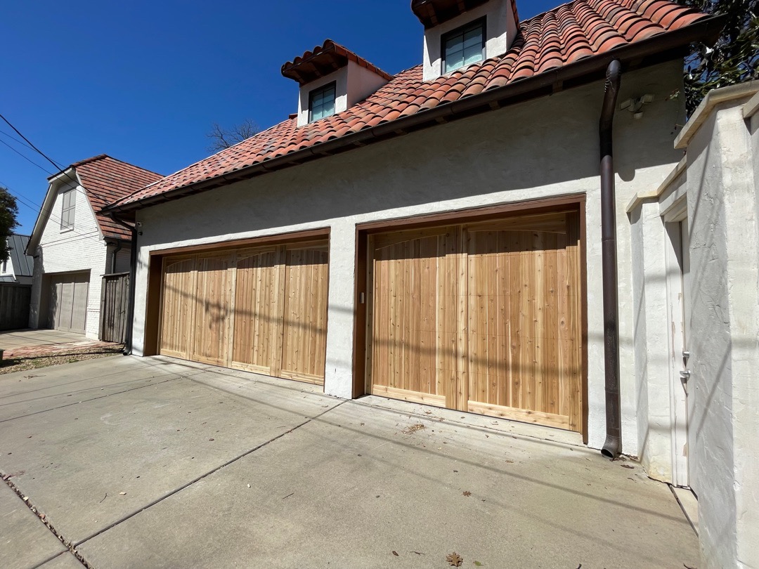 vertical cedar garage doors with eyebrow trim